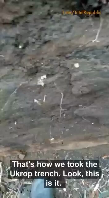 Russian soldier shows cleared trench