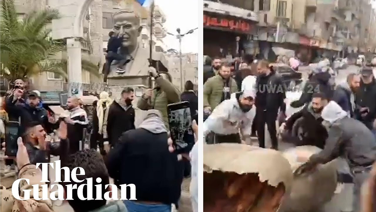 Footage shows protesters toppling statue of Bashar al-Assad's father in Damascus suburb