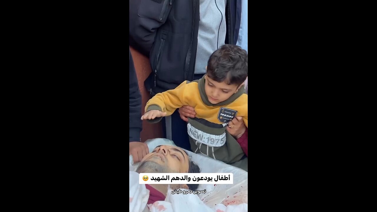 Palestinian children bid farewell to their father who was killed