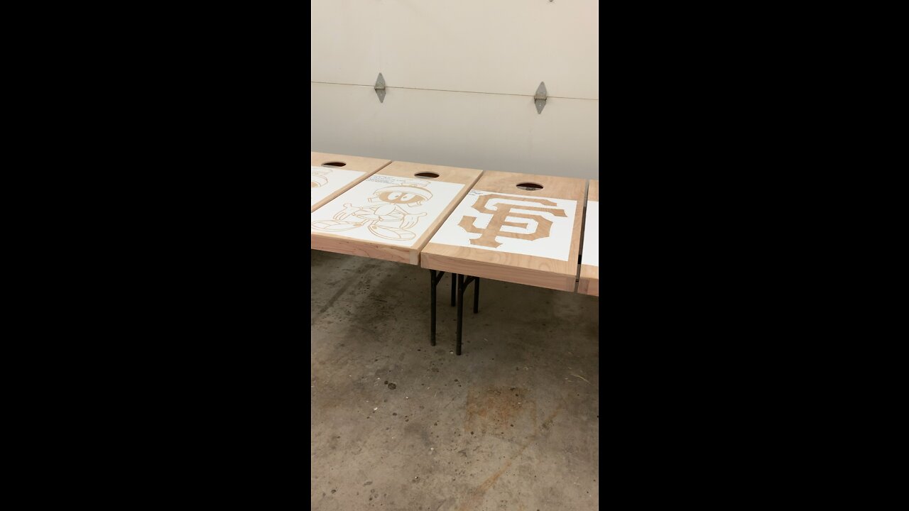 Stencil work on some custom Cornhole boards