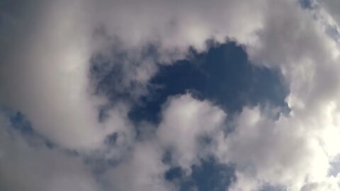 Extremely fast moving clouds with a sun spot