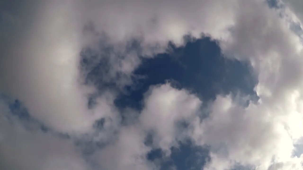 Extremely fast moving clouds with a sun spot