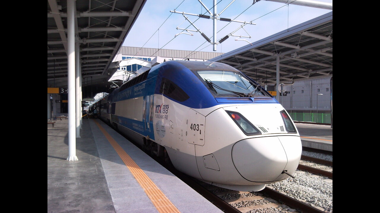 KOREAN BULLET TRAIN KTX CROSSING THE MAIN ROAD