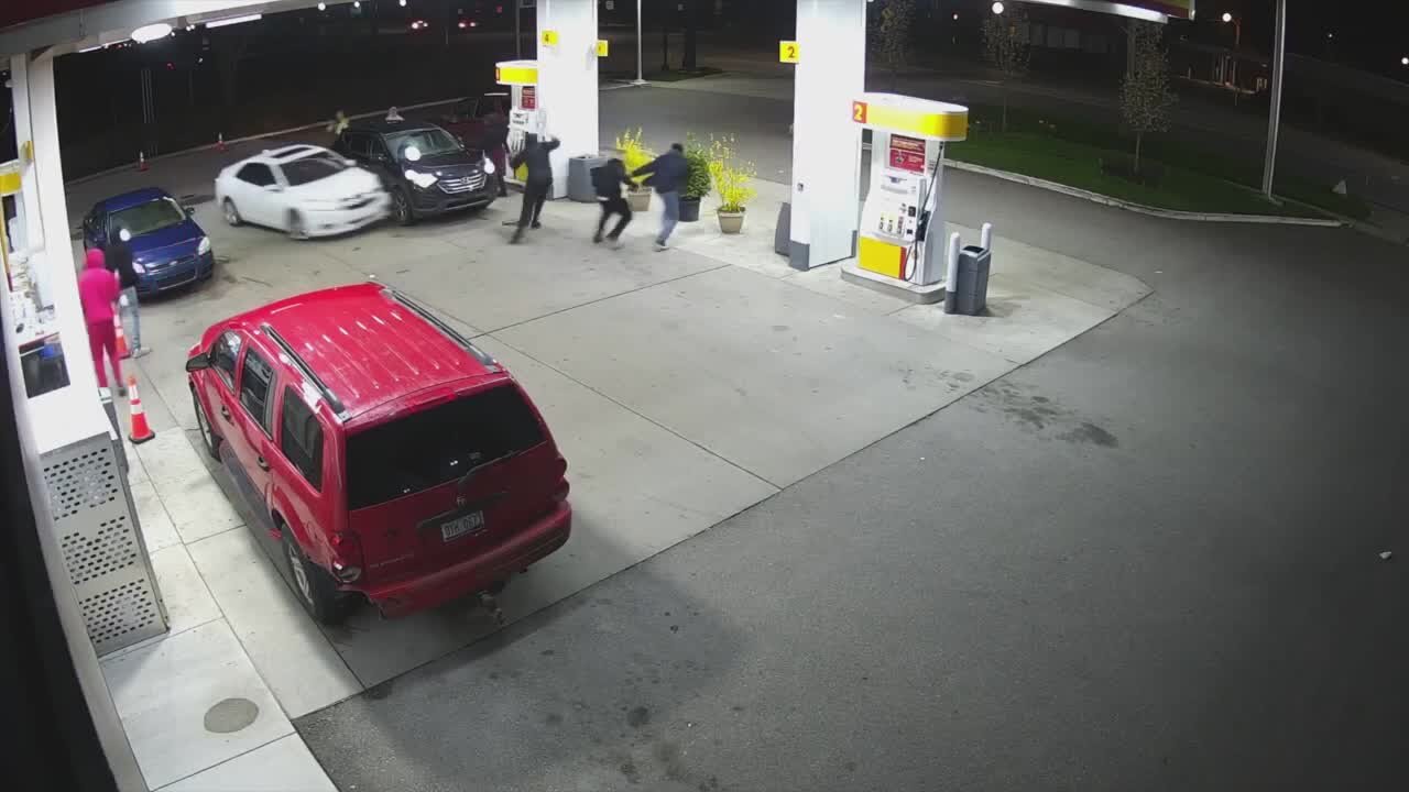 Surveillance shows wild altercation at gas station in Van Buren Township