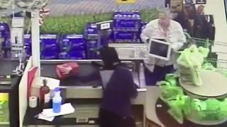 VIDEO: Elderly woman swipes wallet at checkout