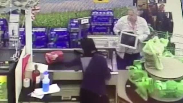 VIDEO: Elderly woman swipes wallet at checkout