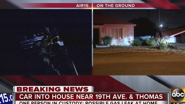 Car into house in Phoenix after driver crashes