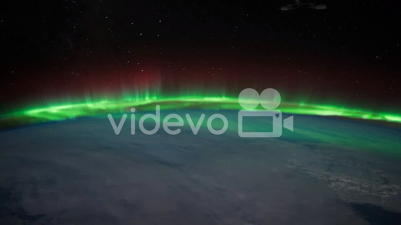 The International Space Station Flies Over The Earth With Aurora Borealis