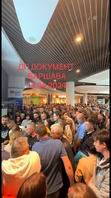 A line of Ukrainian citizens waiting for international passports in Warsaw.