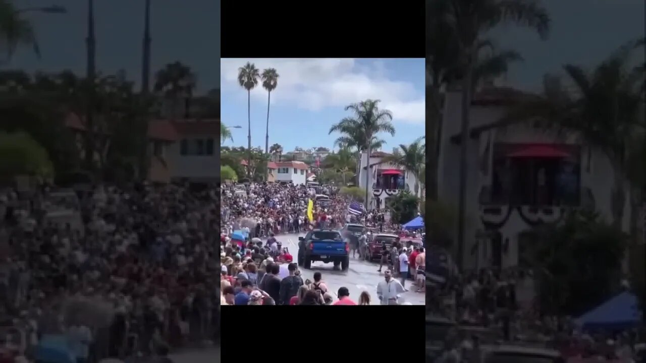 Context: pro-trump truck drives through the course of the annual San Clemente