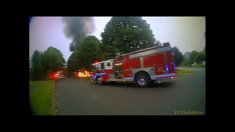 New body camera video shows police officers responding to house fire