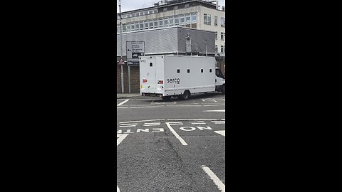 Looks like some baddy is being escorted out of Kingston police station.