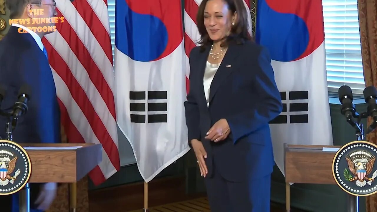 VP Harris wipes her hand after shaking hands with South Korean President.