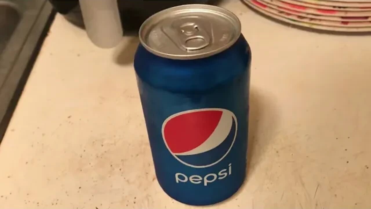 Unopened Pepsi can with barley any soda in it.