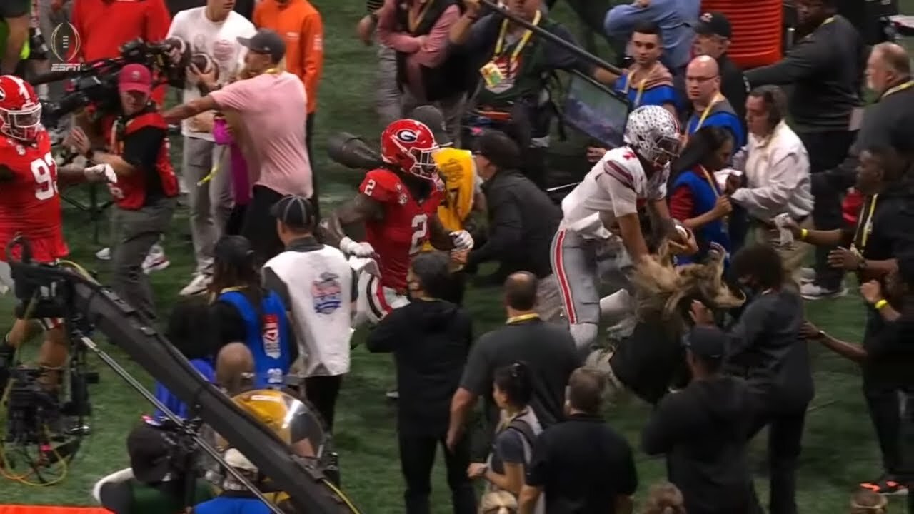 girl on sideline gets run over during Ohio State vs Georgia game