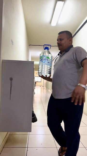 Carrying full bottle of water with single hand