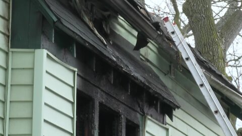 Community members working to help after a deadly house fire on Dartmouth Avenue