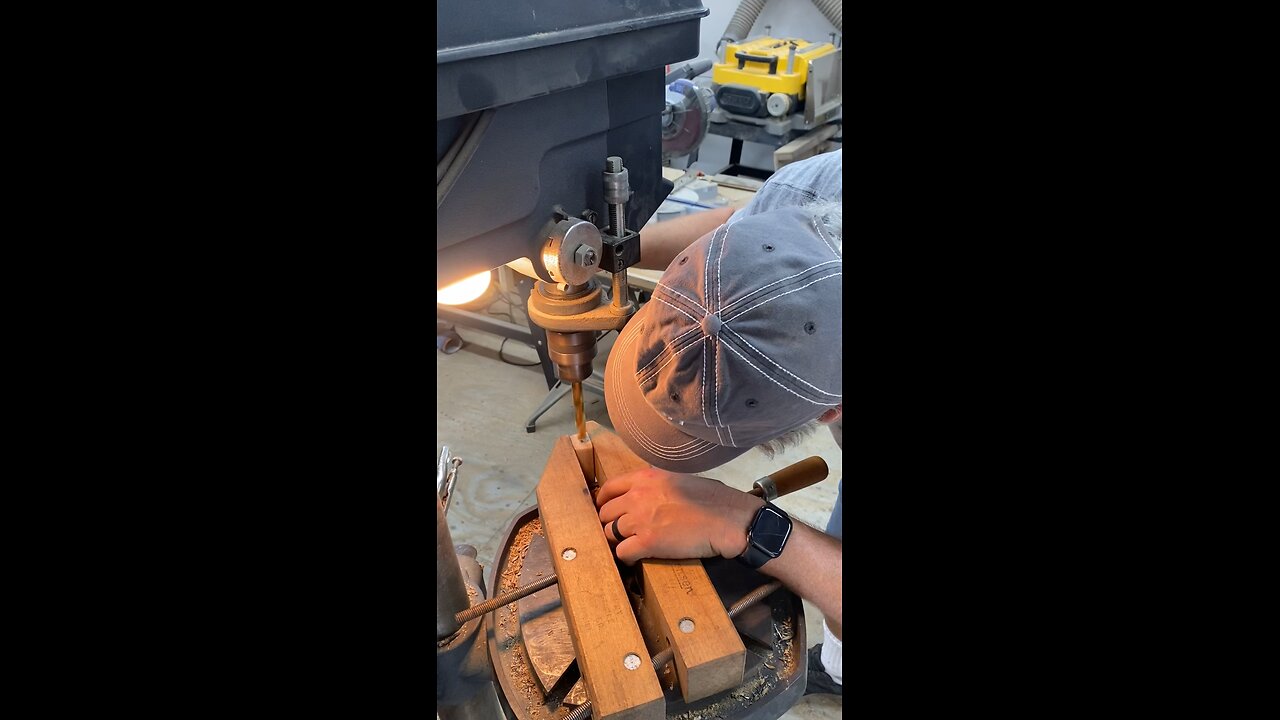 Installing threaded inserts in the end of a bourbon barrel stave.