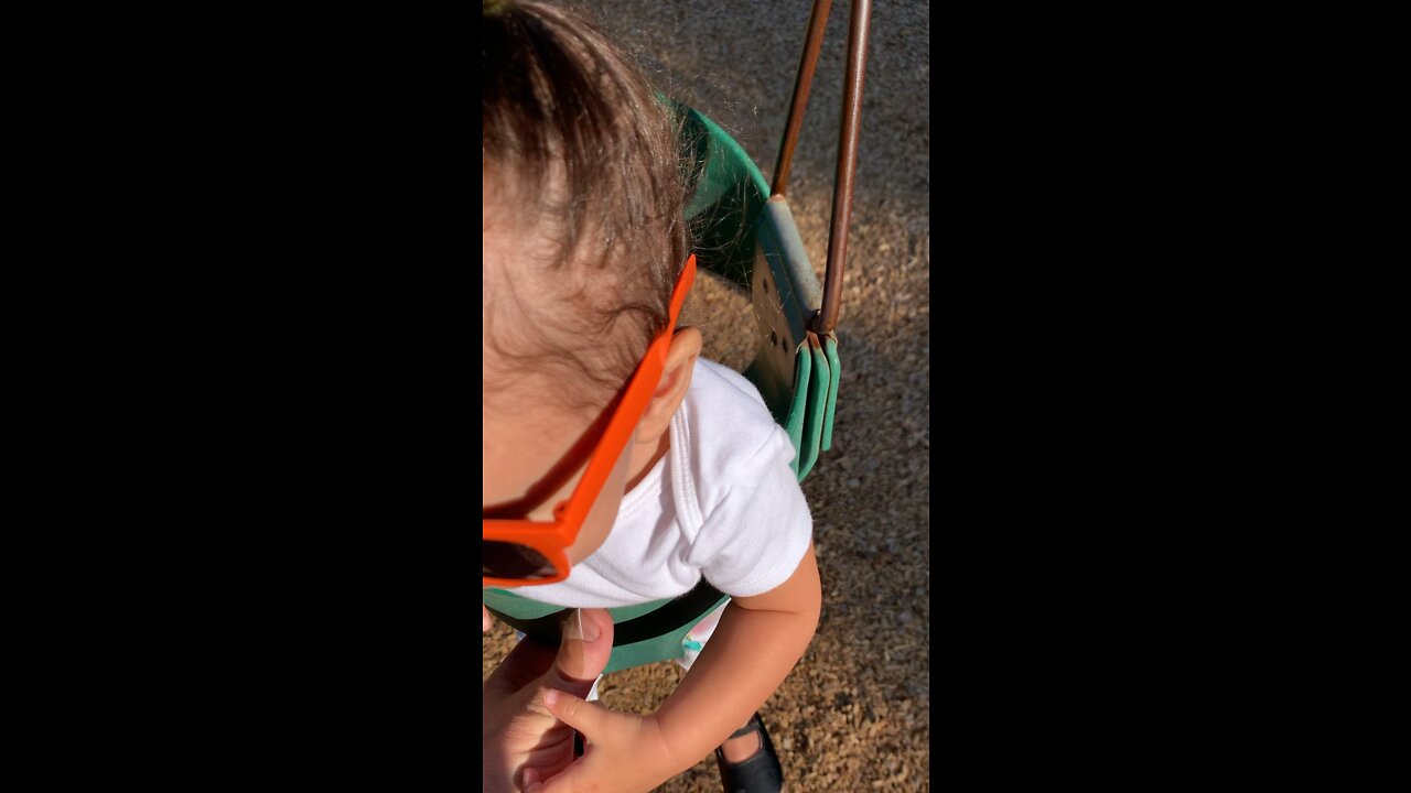 Our cute little girl swinging