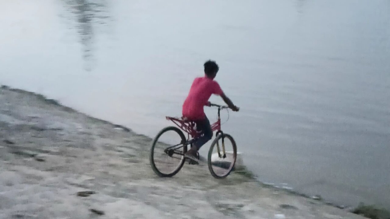 Children Jump in water with cycle watch now
