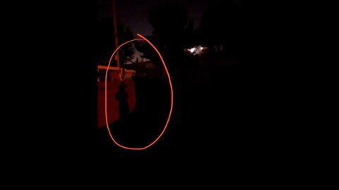 Photograph Of What Appears To Be The Phantom Hat Man Captured On A Recent Investigation Staring Into