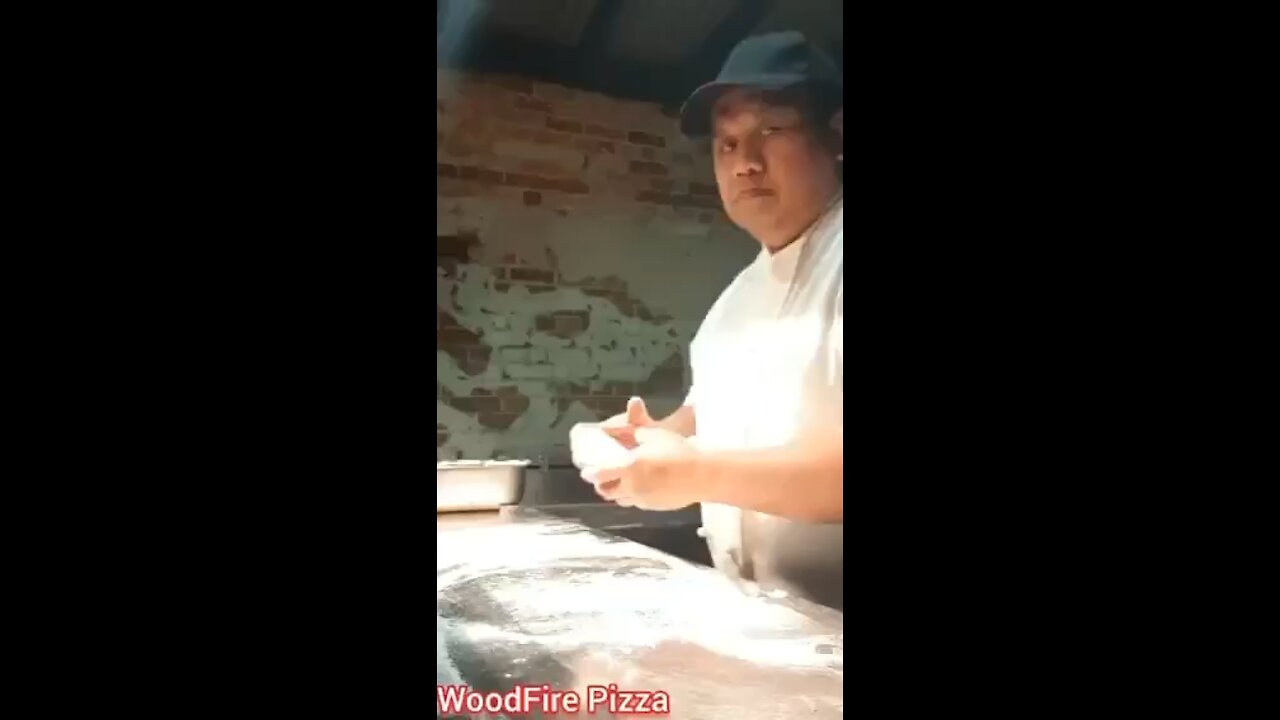 Making Pizza in woof fire oven