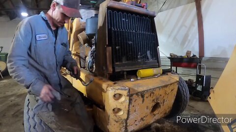 Fixing a few problems on the backhoe.