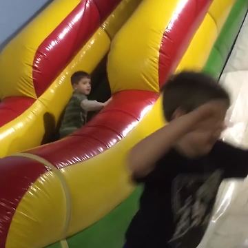 Tot Boy Trips On A Ball And Falls