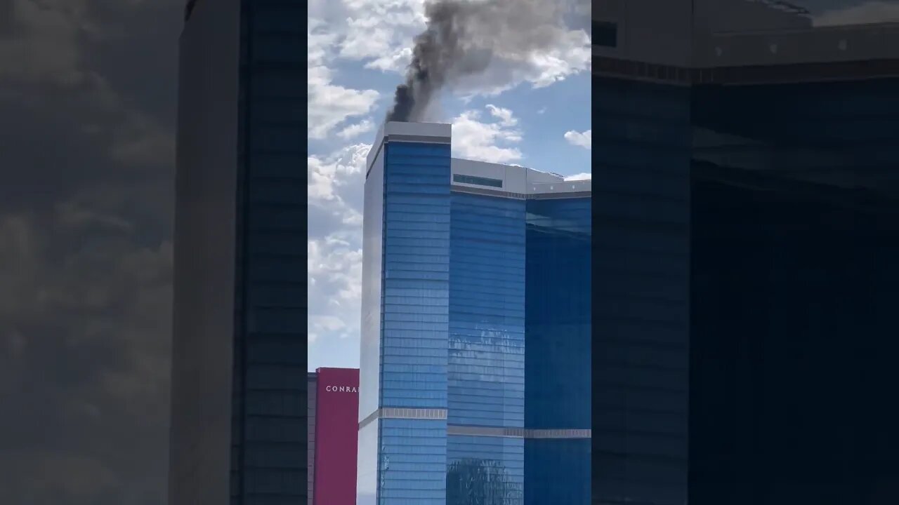 Smoke billowing from rooftop of Fontainebleau Hotel...