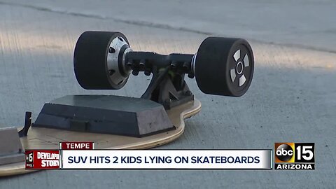 SUV hits two kids on skateboards