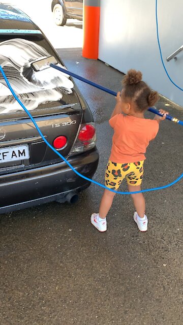 Daughter knows how to wash a car