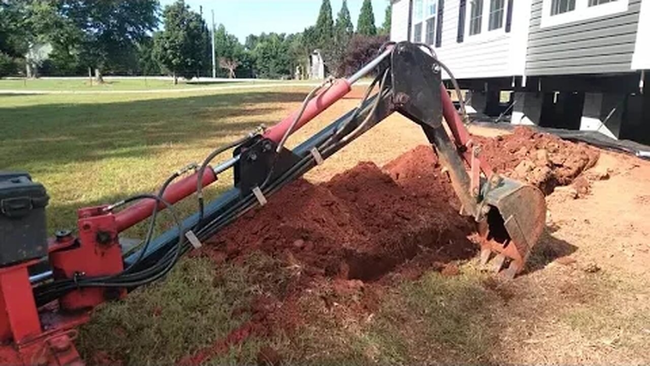 Our new house, episode 3, Harbor Freight trencher installing water line.