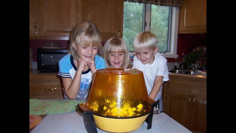 Cute kids watching popcorn pop