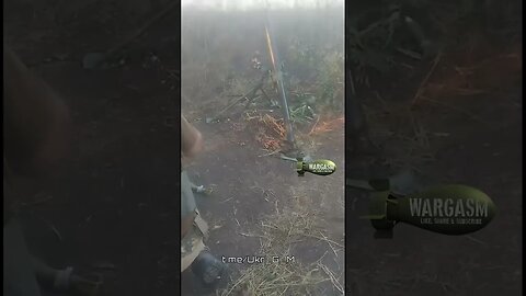 Whacking a mortar tube with a spade