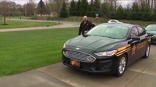 School resource officer visiting homes of 317 graduating Green High School seniors