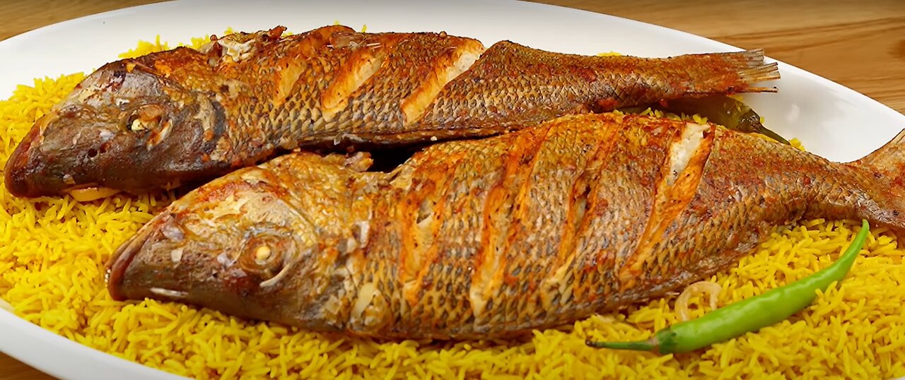 Grilled fish with a special seasoning 🐠 with yellow fish rice and sauce