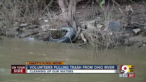 Volunteers from Living Lands and Waters clean up along the Ohio River