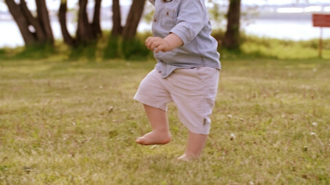 Mama teaches her baby to walk