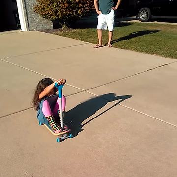 Two Kids Crash Riding A Bike And A Scooter