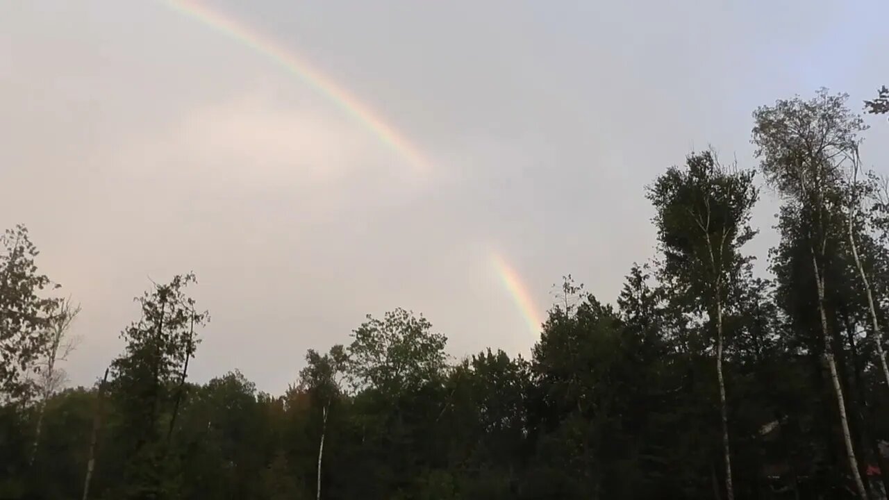 Rainbows, the sky was illuminated tan, pink with fake cloud before & somewhat after the rainstorm