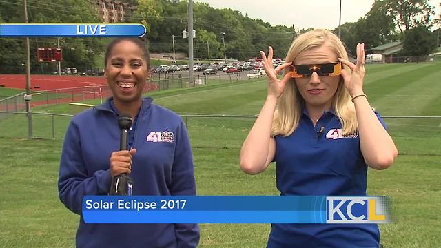 Crowds gather to watch the eclipse across the KC area