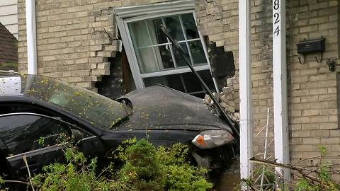 Car crashes into home on West Silver Spring Drive