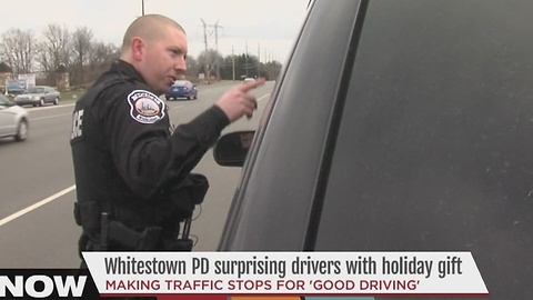 Whitestown police officers hand out cash - not tickets - to drivers