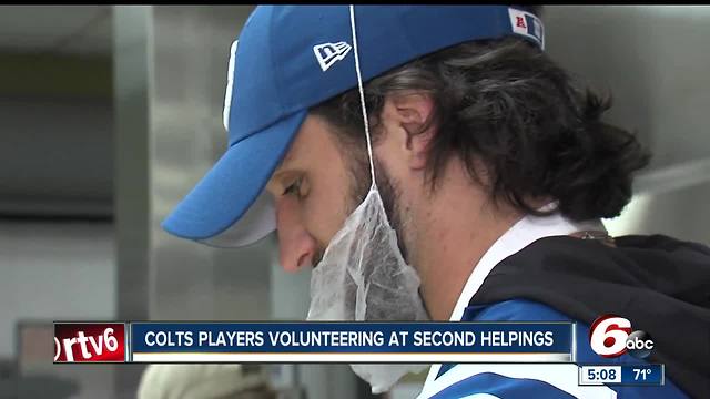 Colts players volunteer at Second helpings