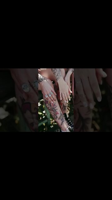 Touching the Legs with Tattoos