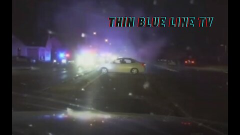 DASHCAM: Suspect Ambushes & Shoots At Officer Sitting In Squad Car, Pursuit Ensues