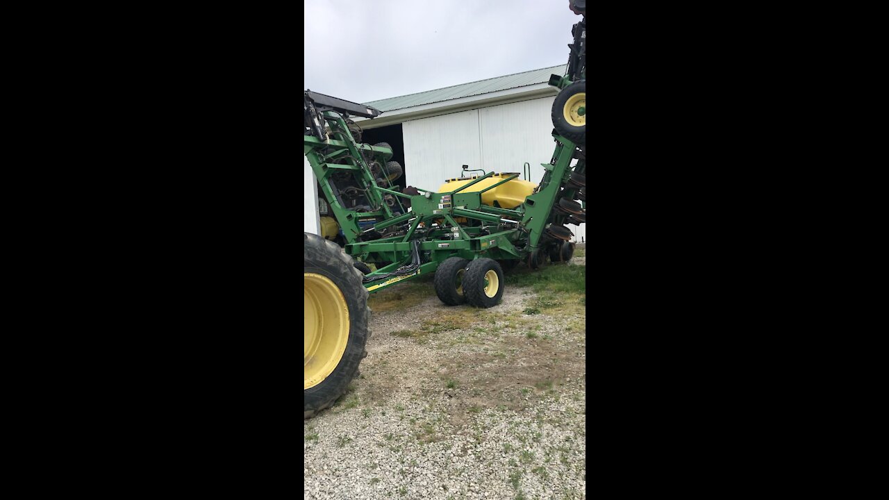 Folding up Big John Deere Air Seeder