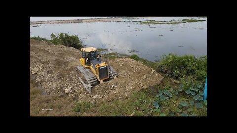 Fantastic construction new road building across lake Bulldozer