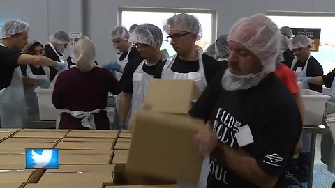 Oshkosh Corporation and Feeding America package rice to help families in need