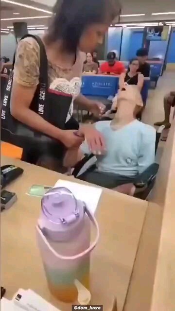 GRAPHIC: This woman wheeled a dead man into the bank and tried to get him to 'sign off'...